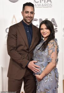 The Bold Type actress Katie Stevens revealed her baby bump for the first time at the CMAs